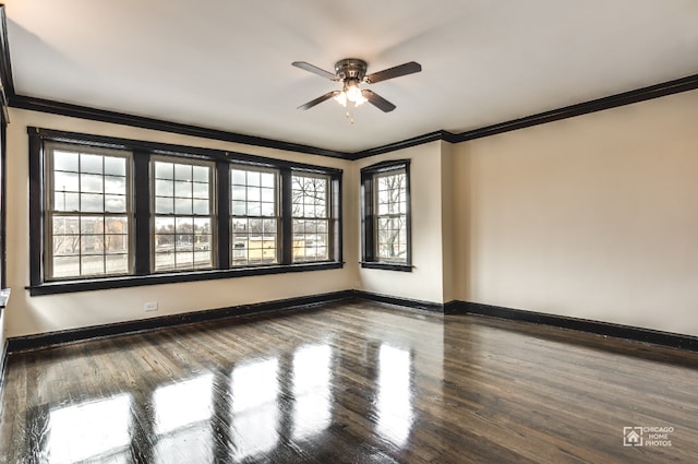 unfurnished room with crown molding, a ceiling fan, baseboards, and wood finished floors