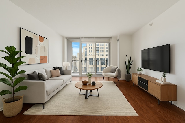 living area featuring expansive windows and dark wood-type flooring