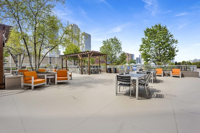 view of patio with a pergola and outdoor dining space