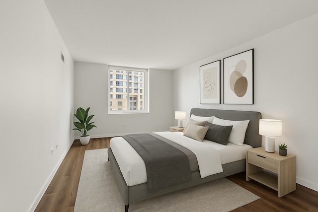 bedroom with dark wood-type flooring and baseboards