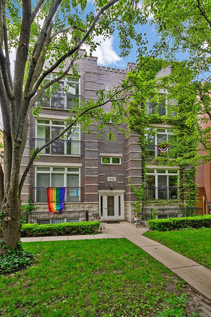 4728 N Malden St Unit 3S, Chicago, IL 60640 - back of house with a yard and brick siding