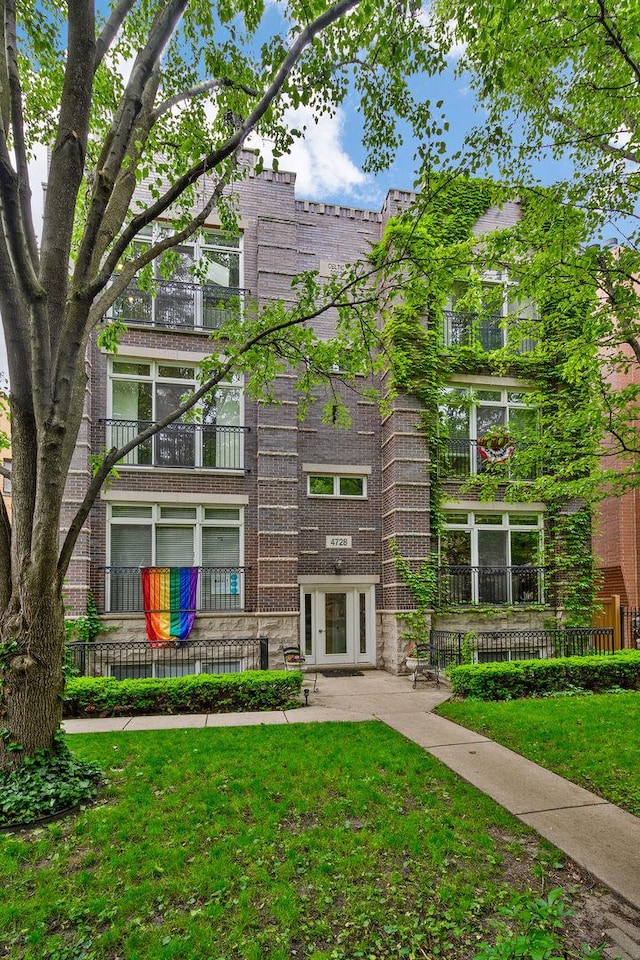 4728 N Malden St Unit 3S, Chicago, IL 60640 - back of house with a yard and brick siding