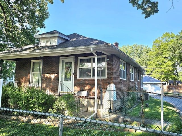 526 Osage St, Joliet, IL 60432 - bungalow featuring brick siding and a detached garage