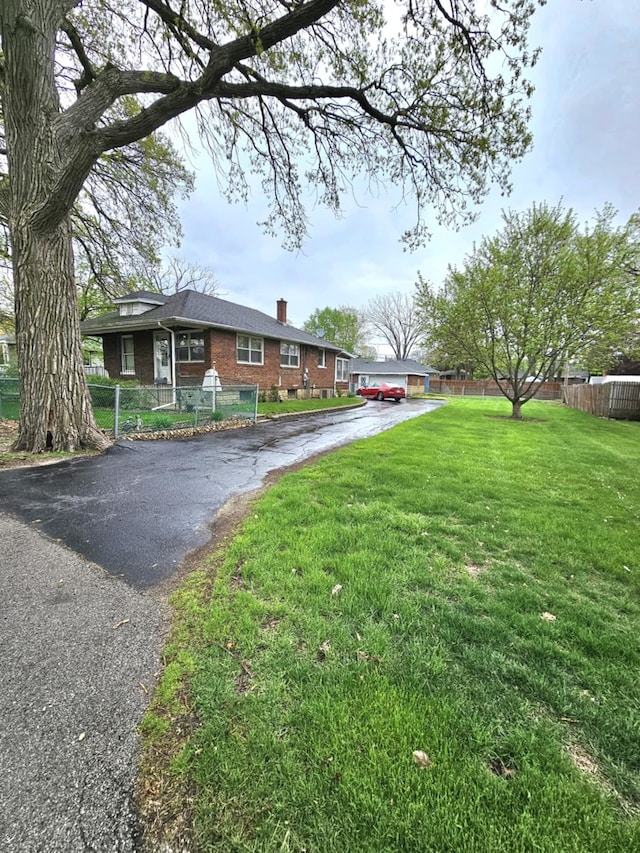 exterior space featuring aphalt driveway