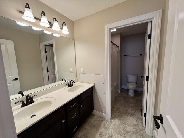 1312 Myrtle Beach Ave, Champaign, IL 61822 - bathroom featuring double vanity, a sink, curtained shower, and toilet