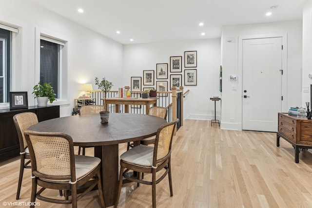 dining room with recessed lighting and light wood-type flooring
