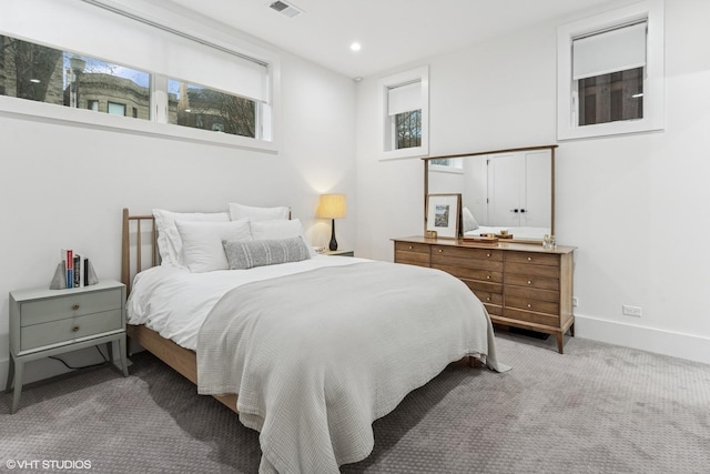 carpeted bedroom featuring baseboards, recessed lighting, and visible vents