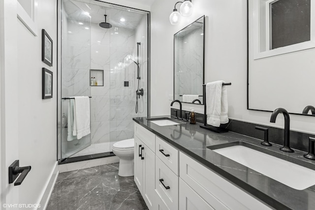 full bathroom featuring a sink, marble finish floor, a marble finish shower, and toilet