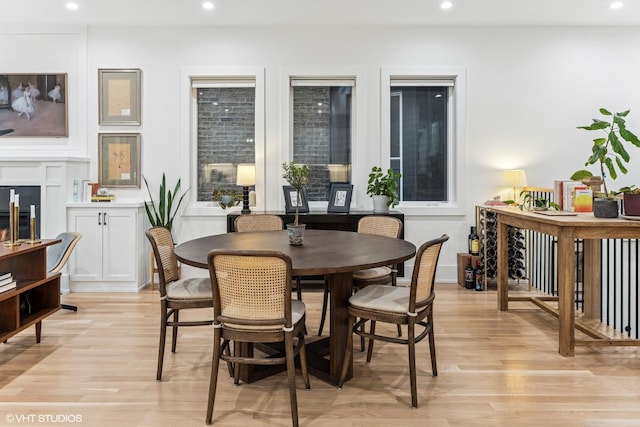 dining space with recessed lighting and light wood-style floors