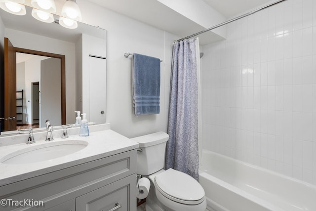 full bathroom featuring vanity, shower / tub combo, and toilet