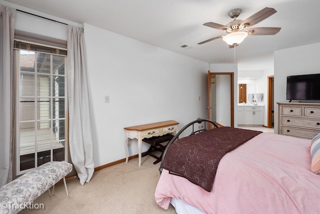 bedroom with ceiling fan, visible vents, light colored carpet, baseboards, and connected bathroom