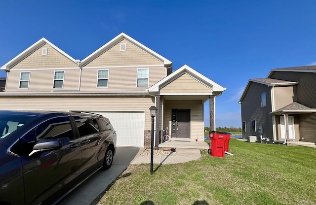 view of front of house with central air condition unit, concrete driveway, a front lawn, and a garage