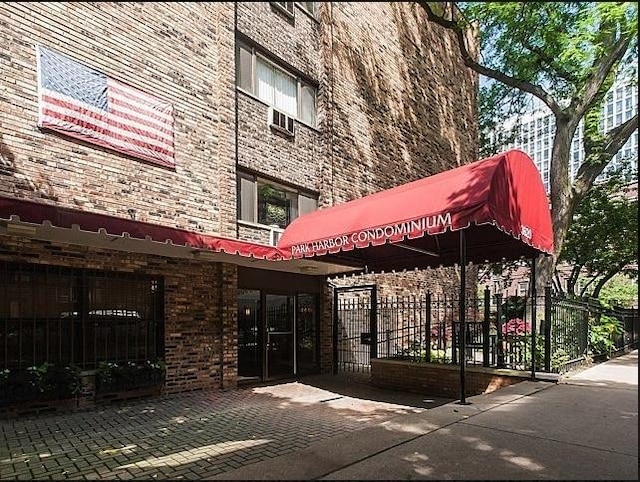 view of property with fence
