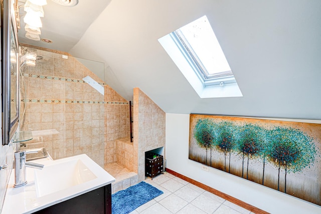 8240 S Champlain Ave, Chicago, IL 60619 - bathroom featuring baseboards, lofted ceiling with skylight, tiled shower, tile patterned floors, and a sink