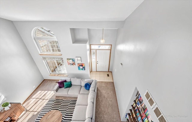 interior space featuring carpet floors and baseboards