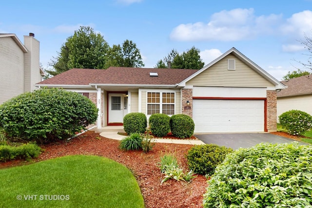 23 S Hankes Rd, Aurora, IL 60506 - ranch-style home featuring asphalt driveway, a garage, brick siding, and roof with shingles
