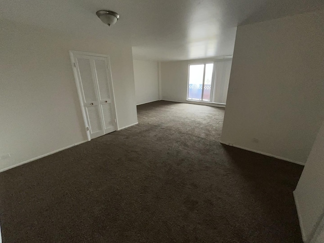 300 Park Ave Unit 443, Calumet City, IL 60409 - empty room with baseboards and dark colored carpet