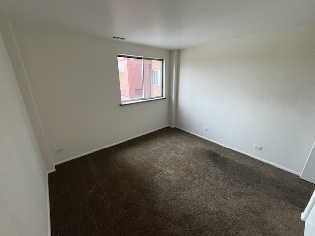 300 Park Ave Unit 443, Calumet City, IL 60409 - empty room with baseboards, dark carpet, and visible vents