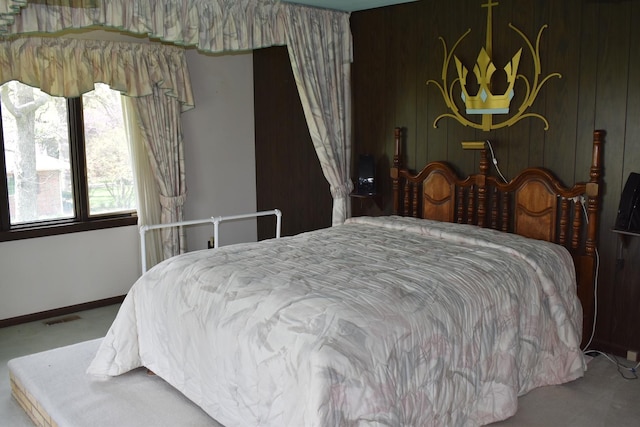 carpeted bedroom with baseboards and visible vents