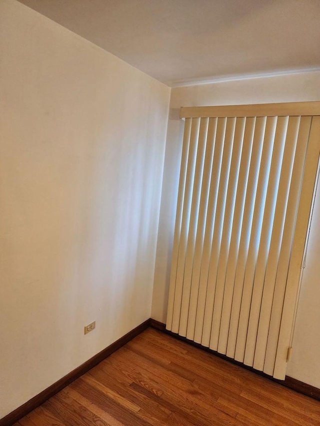 14842 Shepard Dr, Dolton, IL 60419 - unfurnished room with dark wood finished floors and baseboards