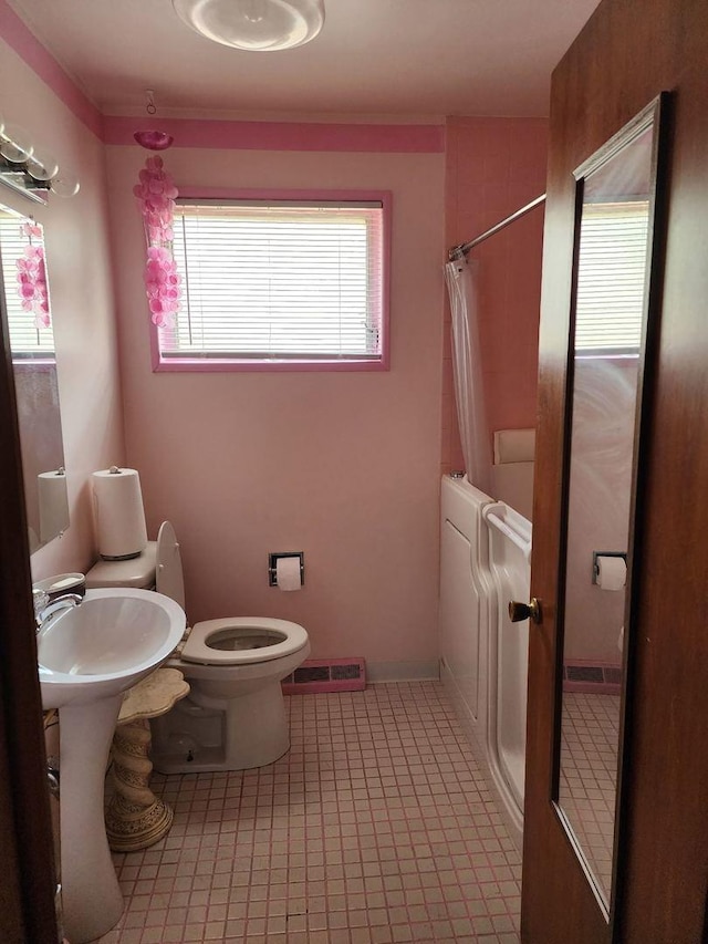 14842 Shepard Dr, Dolton, IL 60419 - bathroom with toilet and tile patterned flooring