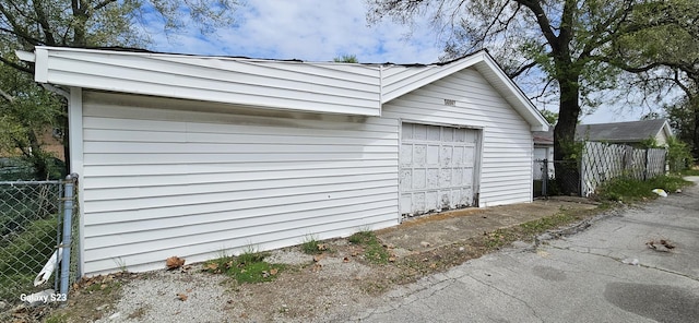 detached garage with fence