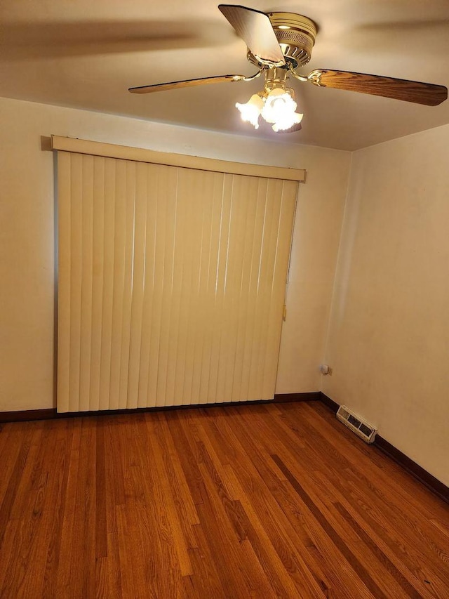 14842 Shepard Dr, Dolton, IL 60419 - unfurnished room featuring ceiling fan, wood finished floors, and baseboards