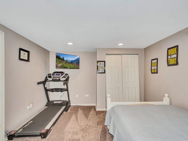 carpeted bedroom with baseboards, a closet, and recessed lighting