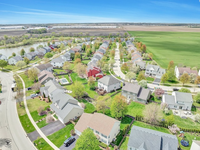 birds eye view of property with a residential view and a water view