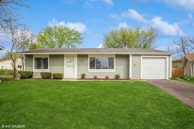 ranch-style house with an attached garage, a front lawn, fence, and concrete driveway