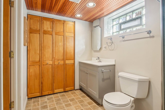 bathroom with toilet, recessed lighting, wooden ceiling, and vanity