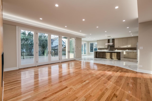 616 Glendale Rd, Glenview, IL 60025 - unfurnished living room featuring recessed lighting, a sink, and light wood-type flooring