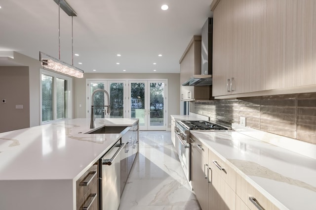 616 Glendale Rd, Glenview, IL 60025 - kitchen featuring a sink, appliances with stainless steel finishes, modern cabinets, and wall chimney range hood