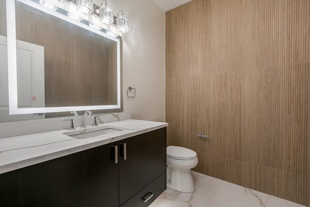 616 Glendale Rd, Glenview, IL 60025 - bathroom featuring toilet, marble finish floor, and vanity