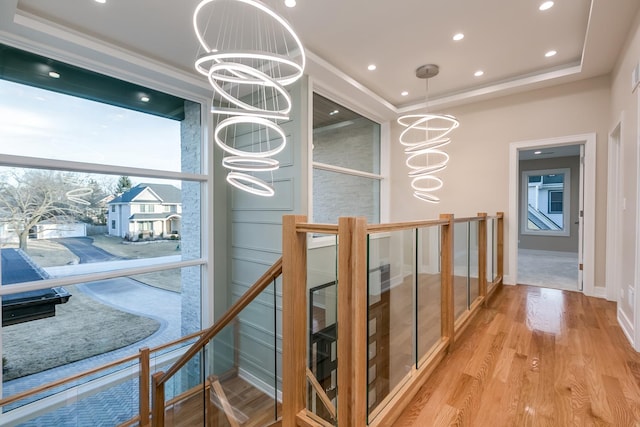 616 Glendale Rd, Glenview, IL 60025 - hall with an inviting chandelier, wood finished floors, baseboards, recessed lighting, and an upstairs landing