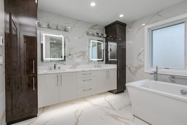 616 Glendale Rd, Glenview, IL 60025 - bathroom with a sink, a freestanding tub, double vanity, and marble finish floor