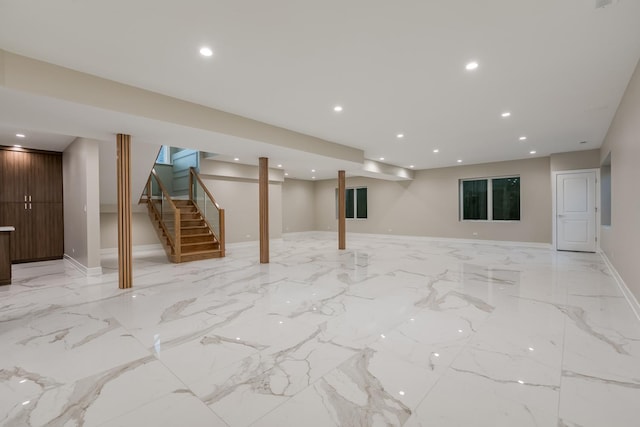 616 Glendale Rd, Glenview, IL 60025 - finished below grade area featuring recessed lighting, marble finish floor, baseboards, and stairway