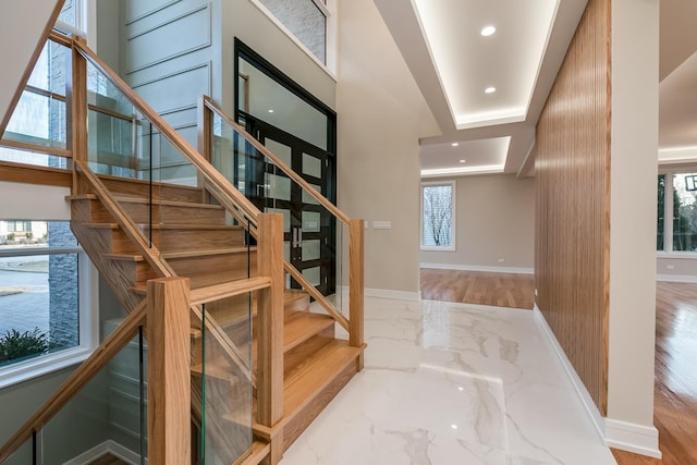 616 Glendale Rd, Glenview, IL 60025 - stairway featuring baseboards, recessed lighting, and marble finish floor