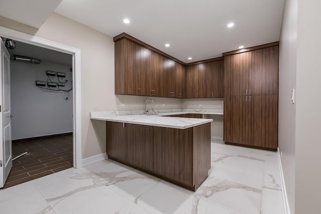 616 Glendale Rd, Glenview, IL 60025 - kitchen featuring baseboards, light stone counters, a peninsula, marble finish floor, and recessed lighting