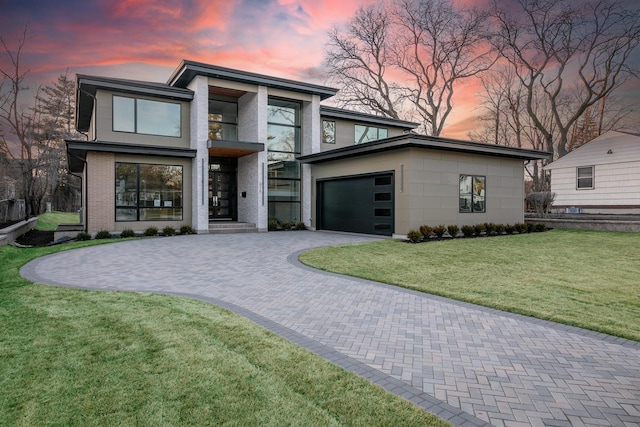616 Glendale Rd, Glenview, IL 60025 - contemporary home with a yard, decorative driveway, a balcony, and a garage