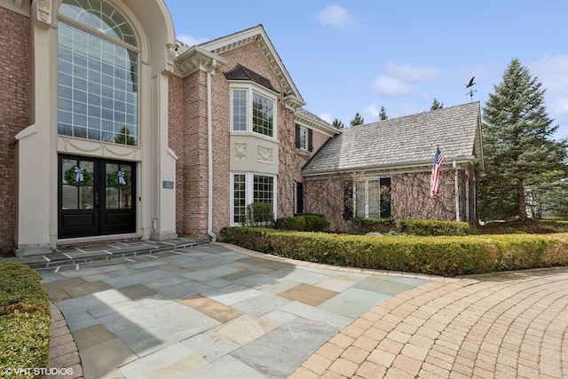 30 Rue Foret, Lake Forest, IL 60045 - view of front of property featuring french doors, brick siding, and a high end roof