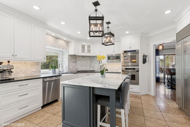 30 Rue Foret, Lake Forest, IL 60045 - kitchen featuring built in appliances, a sink, recessed lighting, stone tile flooring, and tasteful backsplash