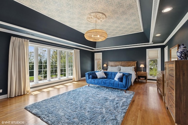 30 Rue Foret, Lake Forest, IL 60045 - bedroom with crown molding, a chandelier, a tray ceiling, wood finished floors, and baseboards