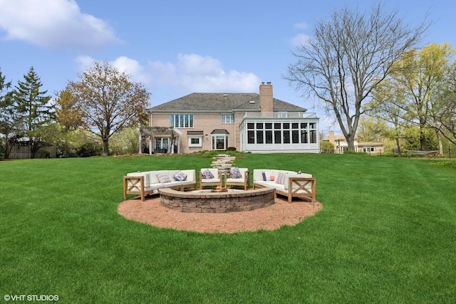 30 Rue Foret, Lake Forest, IL 60045 - rear view of house with an outdoor living space, a chimney, a sunroom, and a yard