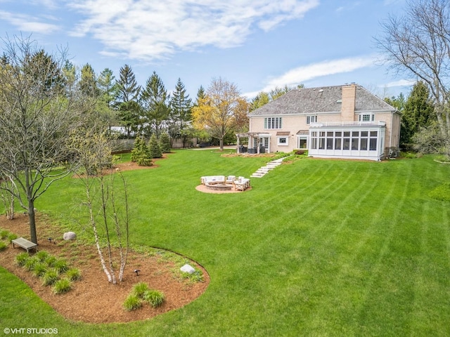 30 Rue Foret, Lake Forest, IL 60045 - view of green lawn with a sunroom and a fire pit