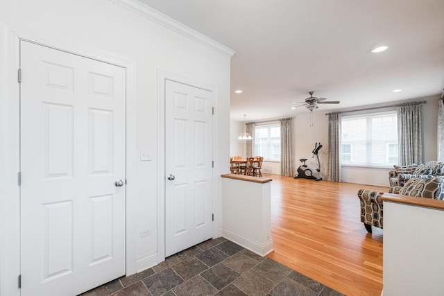 kitchen with crown molding, baseboards, a ceiling fan, and recessed lighting