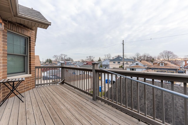 wooden deck with a residential view