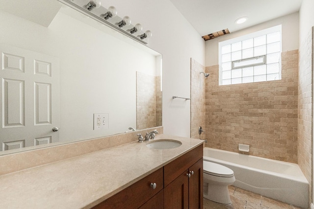 full bath featuring vanity, toilet, and bathtub / shower combination