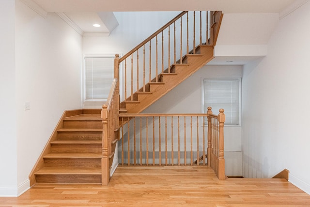 stairs featuring crown molding, recessed lighting, baseboards, and wood finished floors