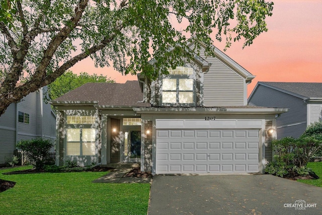 1207 Pennsbury Ln, Aurora, IL 60502 - traditional-style home featuring driveway, a front lawn, and an attached garage